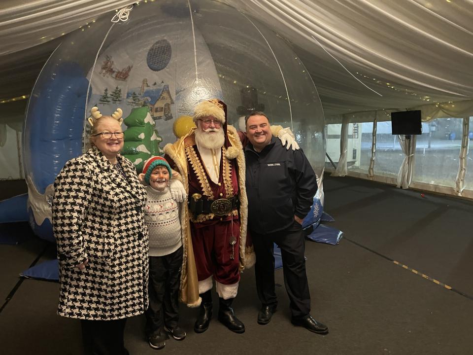 Santa smiles with Llanwern Works Manager Craig Phillips and his family 